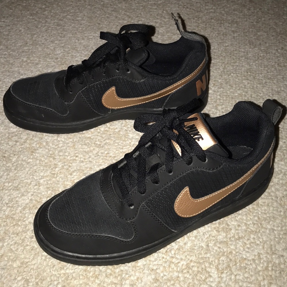 Black and gold Nike sneakers size 9